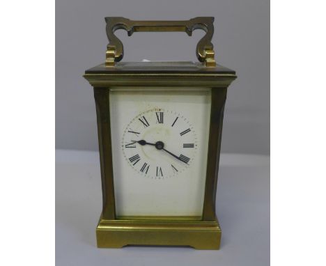 A gilt brass carriage clock with key 