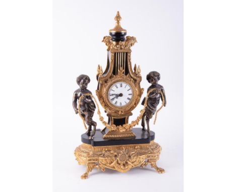 An impressive gold gilt French? Clock decorated with two cherubs either side, height 58cm.