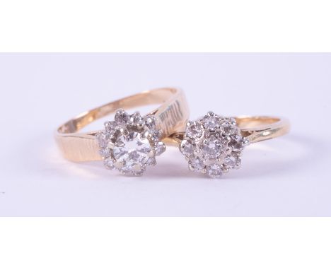 Two rings to include a cluster style ring stamped inside 14-18k set with round brilliant cut diamonds, approx. total diamond 