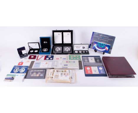 A mixed collection of various coins including Brittania silver proof set 1997, Royal Mint sets of silver coins including the 