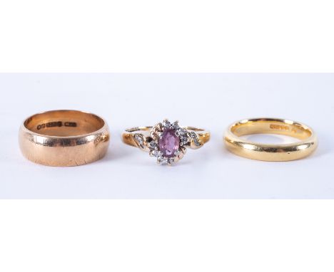 An 18ct yellow gold band, 5.41gm, size L 1/2, a 9ct yellow gold band, 4.35gm and a 9ct yellow gold cluster style ring set wit