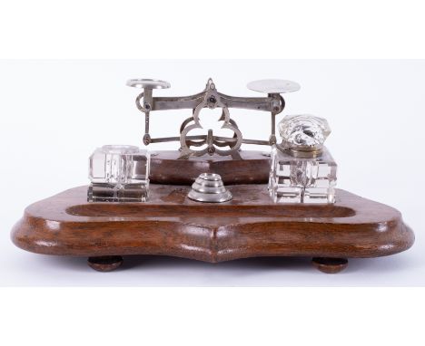 A desk set containing inkwell (one no lid) and weights on stand.