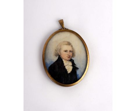 A 19th century miniature portrait of a gentleman on ivory plate in oval brass frame.