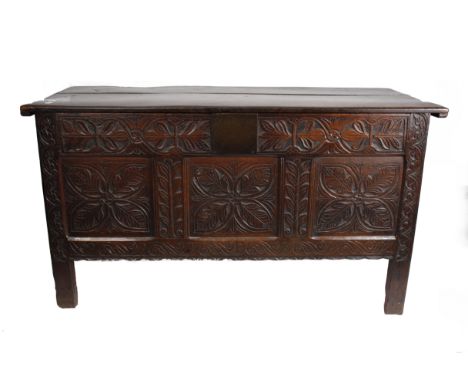 A 18th Century oak Coffer with later carved panel decoration (142w 62d 80h cm)