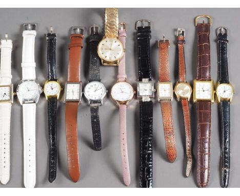 A quantity of mostly ladies and gentlemen’s fashion watches including a gentleman’s Timex wristwatch with silvered dial, Arab