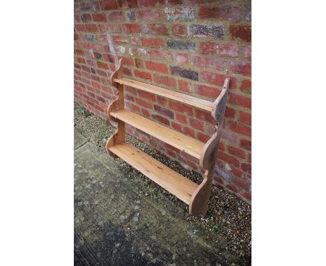 A pine three-tier open wall shelf, 36" wide x 8" deep x 36" high