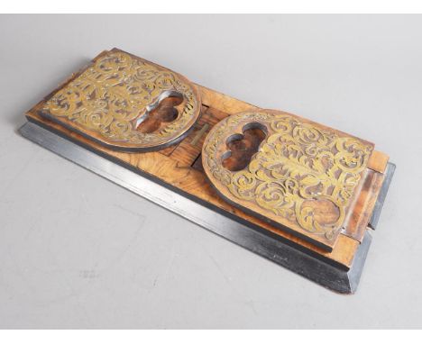 A Victorian burr walnut and pierced and scroll brass mounted pair of sliding bookends, 15 3/4" wide,&nbsp;and a floral embroi