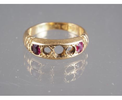 An 18ct gold and ruby ring, size L, 3.5g (two stones missing)
