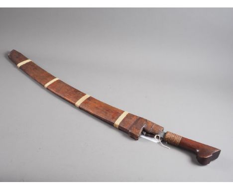 An Indonesian, possibly Kalimantan, Parang curved blade sword with pierced and engraved blade with woven and hardwood handle 