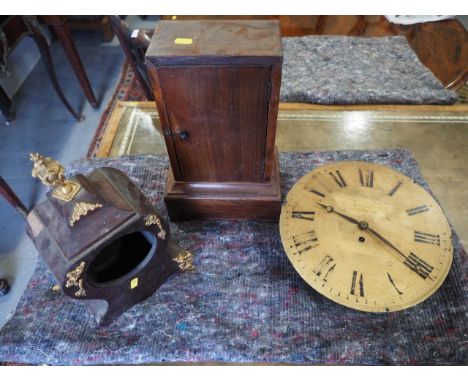 An early 20th century mahogany cased mantel clock with silvered dial, a wall clock with single fusee movement for repair, a r