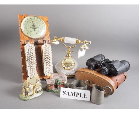 A "crystal" telephone, a table clock, an aneroid barometer, a pair of binoculars, six composition cottages, etc