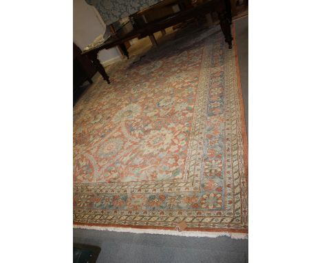 An Egyptian Ziegler wool pile carpet with all-over floral design in shades of blue and cream on a rust ground, 172" x 116" ap