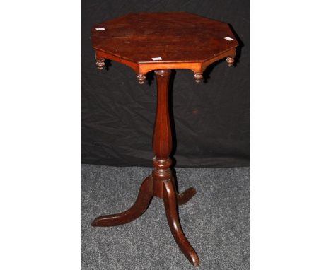 A 19th century mahogany tripod table, the octagonal ' plum pudding' top with drop finials on tapered column and swept legs. 7