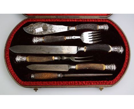 Joseph Rodgers and others, a matched six piece set of antler handled carving tools, five with cast ram's mask silver terminal