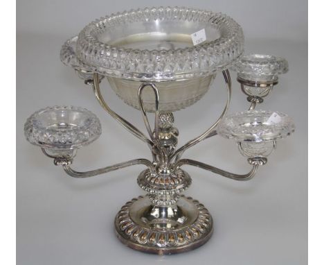 A late Victorian silver plated epergne, with five cut glass bowls on reeded stems around pineapple boss on lobed circular foo