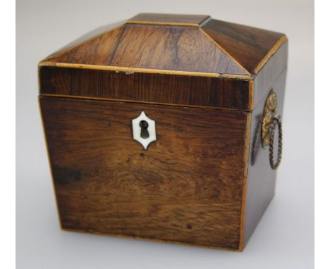 A 19th century rosewood, boxwood strung tea caddy of sarcophagus form with ivory escutcheon, twin gilt metal ring handles and