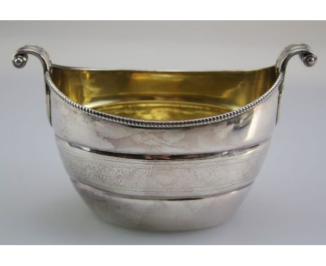 A late 18th/ early 19th century possibly Colonial unmarked silver sugar basin, the scroll leaf handles and beaded rim over ri