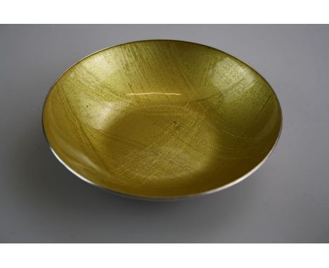 Jacob Tostrup, a 20th century Norwegian stirling silver and tooled mustard enamel shallow dish. 12.5cm diameter