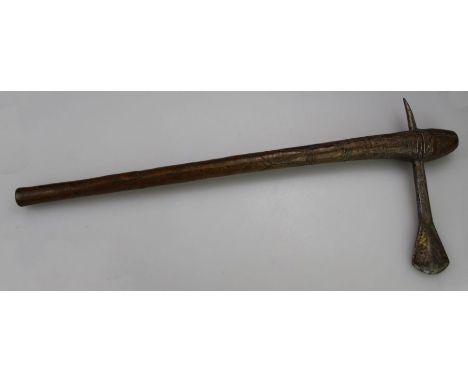 A Shona carved axe, the carved wood handle having a white metal blade, Zambia or South African. H65cm