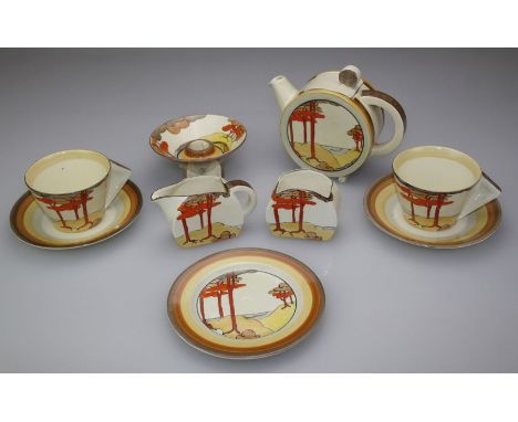 Clarice Cliff, a Coral Firs pattern tea for two. Comprising teapot, milk, sugar, two tea cups and saucers, tea plate and a ca