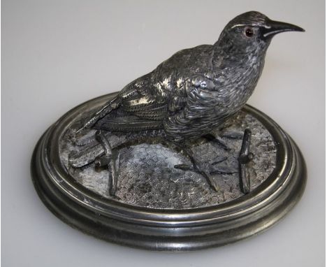 James Deakin and Sons, a silver plated inkstand, realistically modelled as a thrush with amber glass eyes, centrally hinged w