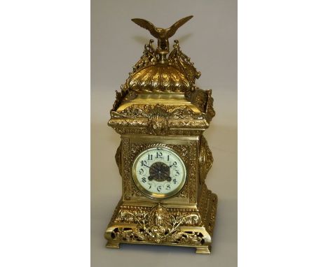 Japy Freres, an ornate late 19th century French brass mantle clock, the architectural domed case with eagle surmount and mask
