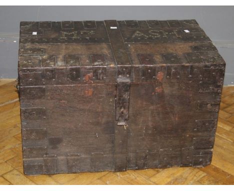 An early 19th century oak, steel bound silver chest, named in brass studs 'Mrs Ash', with twin side handles, functioning lock