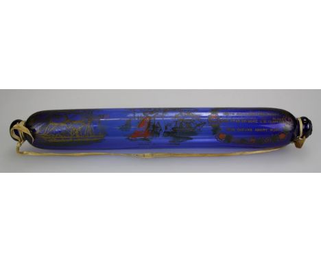 A Victorian ' Bristol' blue glass rolling pin, gilt decorated with figures, ships and verse, ' Jacks Safe Return'