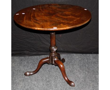 A George III mahogany tripod table, the circular snap top over birdcage, gunbarrel and wrythen column , on swept legs and pad