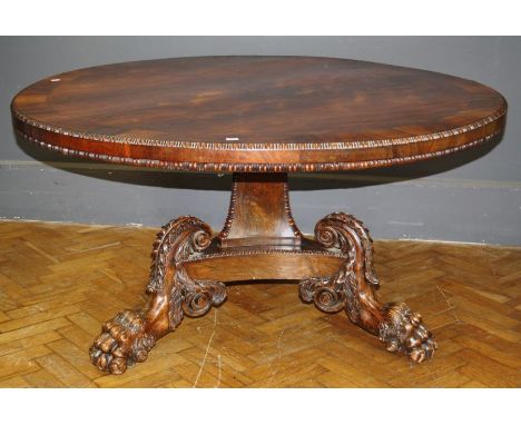 A fine William IV rosewood breakfast table, the crossbanded egg and dart moulded tilt top on conforming concave tapering colu