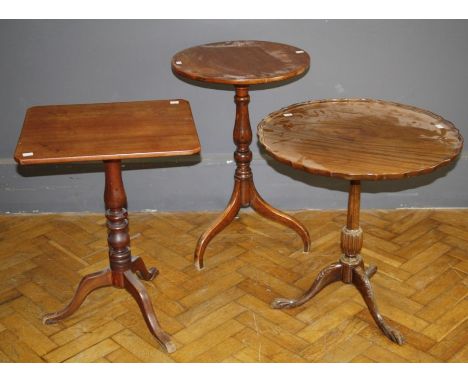 A late 19th century mahogany tripod table with canted rectangular snap top, a circular top mahogany tripod table and a reprod