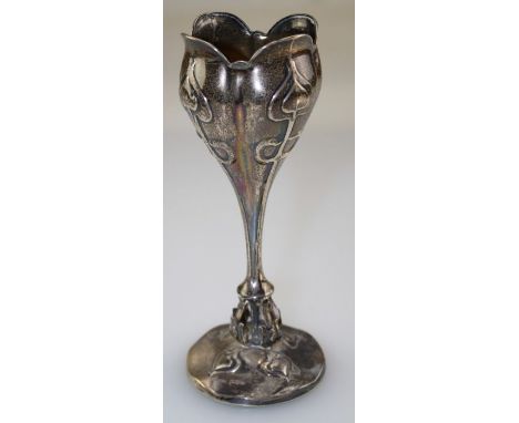 William Neale, an Edwardian Art Nouveau silver tulip form vase, decorated with panels of raised stylised flowers on a taperin