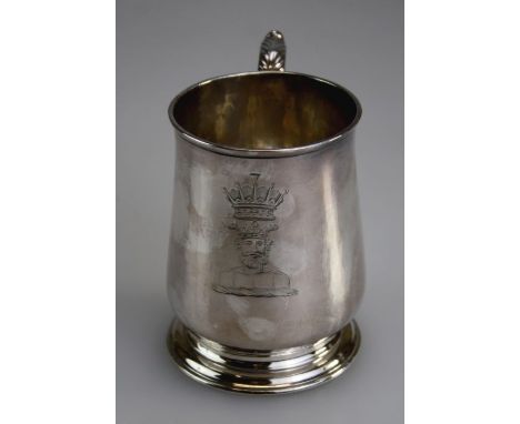 A silver tankard, late 18th/ early 19th century, with capped scroll handle and Neptune crest, on stepped circular foot, Londo