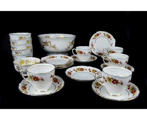 A Crown Staffordshire Aristocrat fruit service, white gilded with floral sprays comprises centrepiece fruit bowl and six serv
