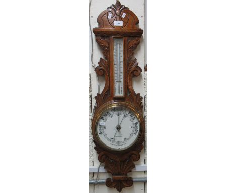 Early 20th century carved oak aneroid barometer marked Jenkins &amp;Co Carmarthen.  (B.P. 21% + VAT) 