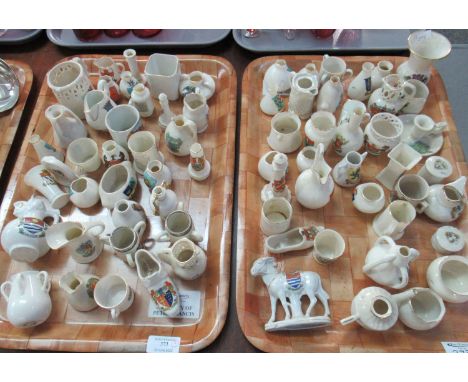 Two trays of miniature Crested Ware to include: donkey, lighthouse, clog, various jugs and vases, including a jug with a grif