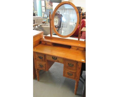 Modern pitch pine mirror back kneehole dressing table on turned legs.  (B.P. 21% + VAT) 