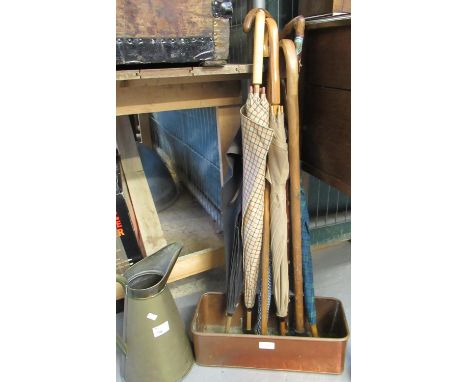 Collection of walking sticks and umbrellas, together with a copper planter and a brass jug.(B.P. 21% + VAT) 