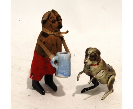 SCHUCO, GERMANY, TINPLATE AND VELVET FIGURE OF A STANDING DOG DRINKING FROM A STEIN, some losses to costume, 4 1/4" (10.8cm) 