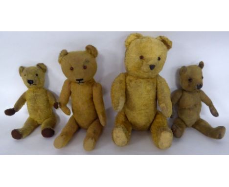 A CIRCA 1930'S/40'S CHILTERN TEDDY BEAR golden plush, fabric pads and glass eyes 15" (38 cm) long, and three other pre and po