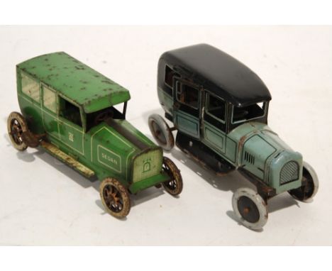 LEHMANN, GERMANY, GREEN LITHOGRAPH TIN PLATE CLOCKWORK 'SEDAN' CAR circa 1930s with tin plate eight spoke wheels, 5 1/2" (14c