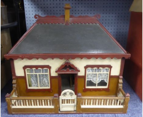 EARLY 20th CENTURY PAINTED WOODEN DOLL'S HOUSE 'Railway Cottage' with fronted fence and gate, 24 1/4" (61.5cm) wide, 19" (48c