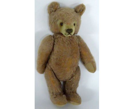 AN INTER-WAR YEARS GERMAN STEIFF PINKISH PLUSH TEDDY BEAR with cream felt pads and muzzle, with glass eyes and growler, butto