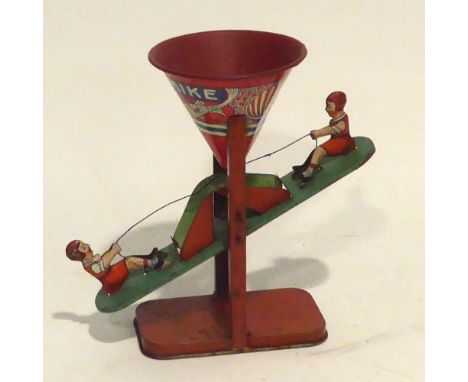 AMERICAN, CIRCA 1920s J. CHEIN & CO LITHOGRAPH TIN PLATE 'BUSY MIKE' SEE-SAW TOY activated tipper-type action fed from a coni