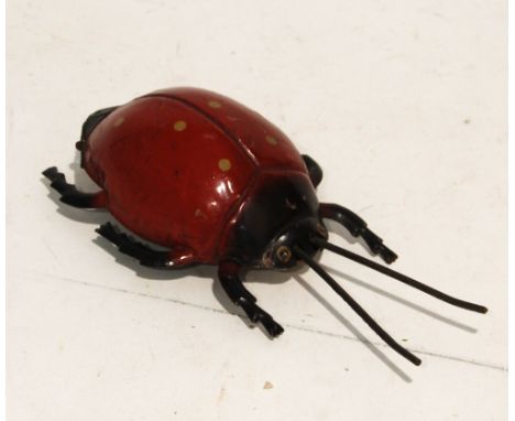 GUNTHERMANN, BAVARIA LARGE TINPLATE AND ENAMEL CLOCKWORK LADYBIRD with forward and random action, printed to the base Systeme