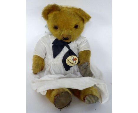 A CIRCA 1953 CHILTERN TING-A-LING BRUIN BEAR, golden plush, black fabric pads and glass eyes, growler inoperative, 19" (48 cm
