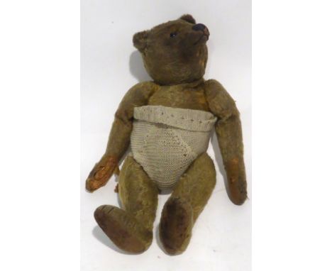 VINTAGE TEDDY BEAR, PROBABLY BY STEIFF with pale golden fur, straw filled, glass eye (one missing), black stitched snout, pro