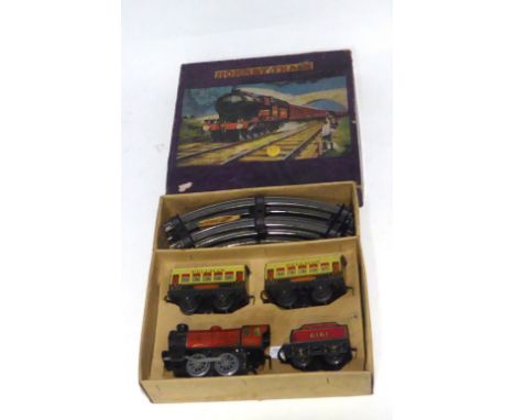 'HORNBY TRAIN' CIRCA 1930s '0' GAUGE LITHOGRAPH TIN PLATE CLOCKWORK M.O. PASSENGER SET containing 0-4-0 locomotive and tender