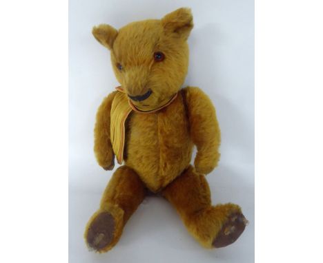 A CIRCA 1930'S CHAD VALLEY GOLDEN PLUSH TEDDY BEAR with labelled fabric pads and glass eyes (one pad distressed) named 'Ramse