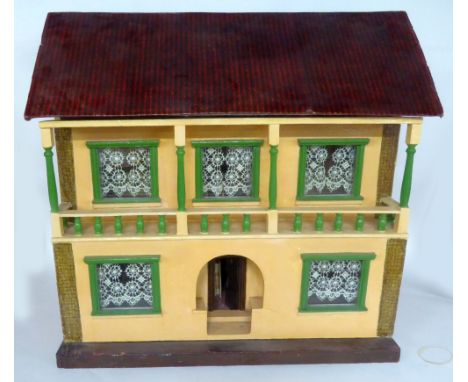 20th CENTURY PAINTED WOODEN DOLL'S HOUSE with inglenook doorway and balcony above, beneath a printed paper simulated red tile